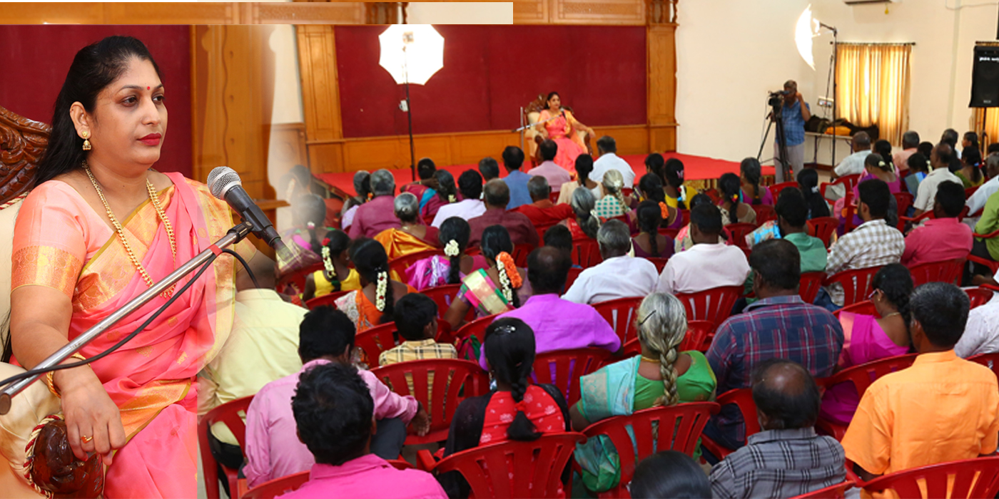 Amma guiding devotees in spiritual class